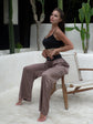 Silk trousers in a refined shade of deep taupe