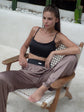 Silk trousers in a refined shade of deep taupe