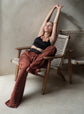 Silk trousers in a rich mahogany hue